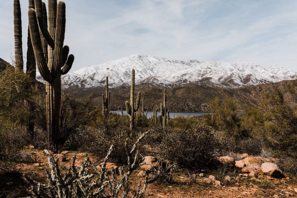 The scenic Apache Trail in the winter with snow capped mountains.