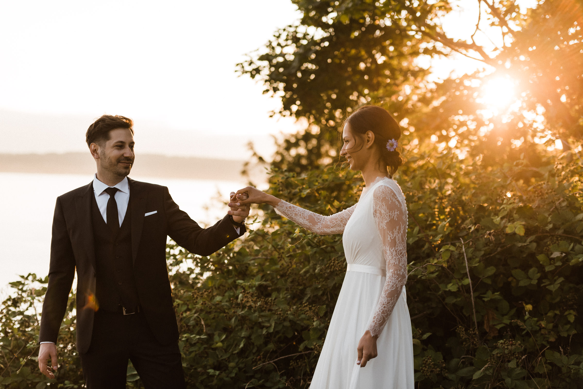 Wedding couple at sunset during a Discovery Park Seattle elopement.