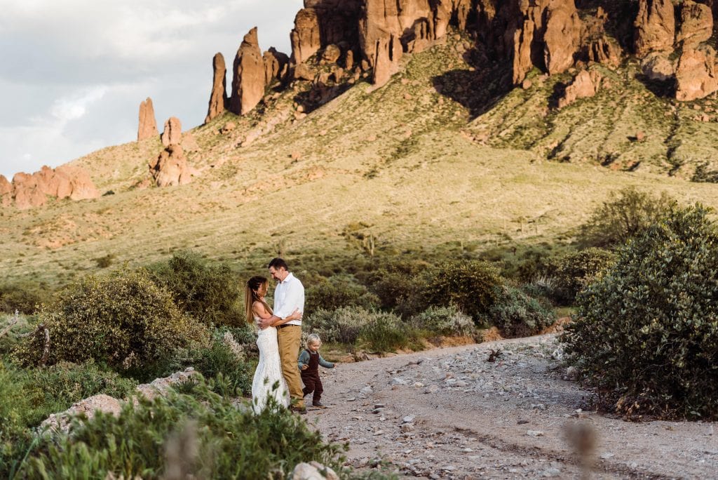A couple eloping in the Superstition Mountain foothills with their toddler.