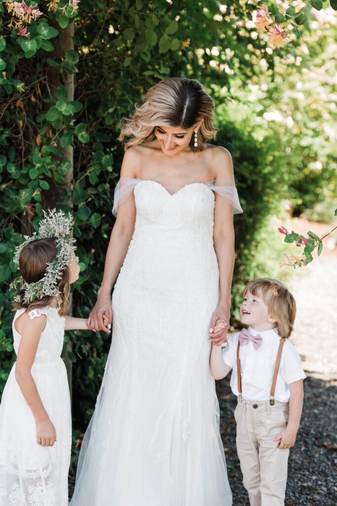 Bride with young girl and boy at intimate wedding in the Pacific Northwest.